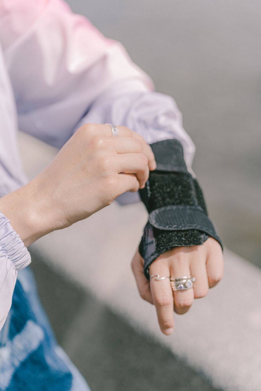 Close-up of a hand fitted with a wrist splint, similar to the protective splinting used in mallet finger care