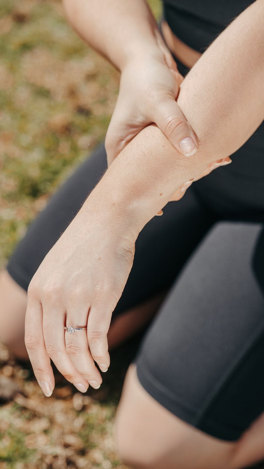 Person holding their wrist in pain — a common symptom of a TFCC tear