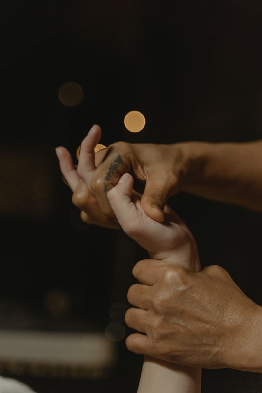 Close-up of soothing hand massage therapy targeting finger tendons and palm
